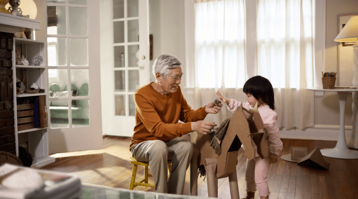 Grandfather playing with granddaughter