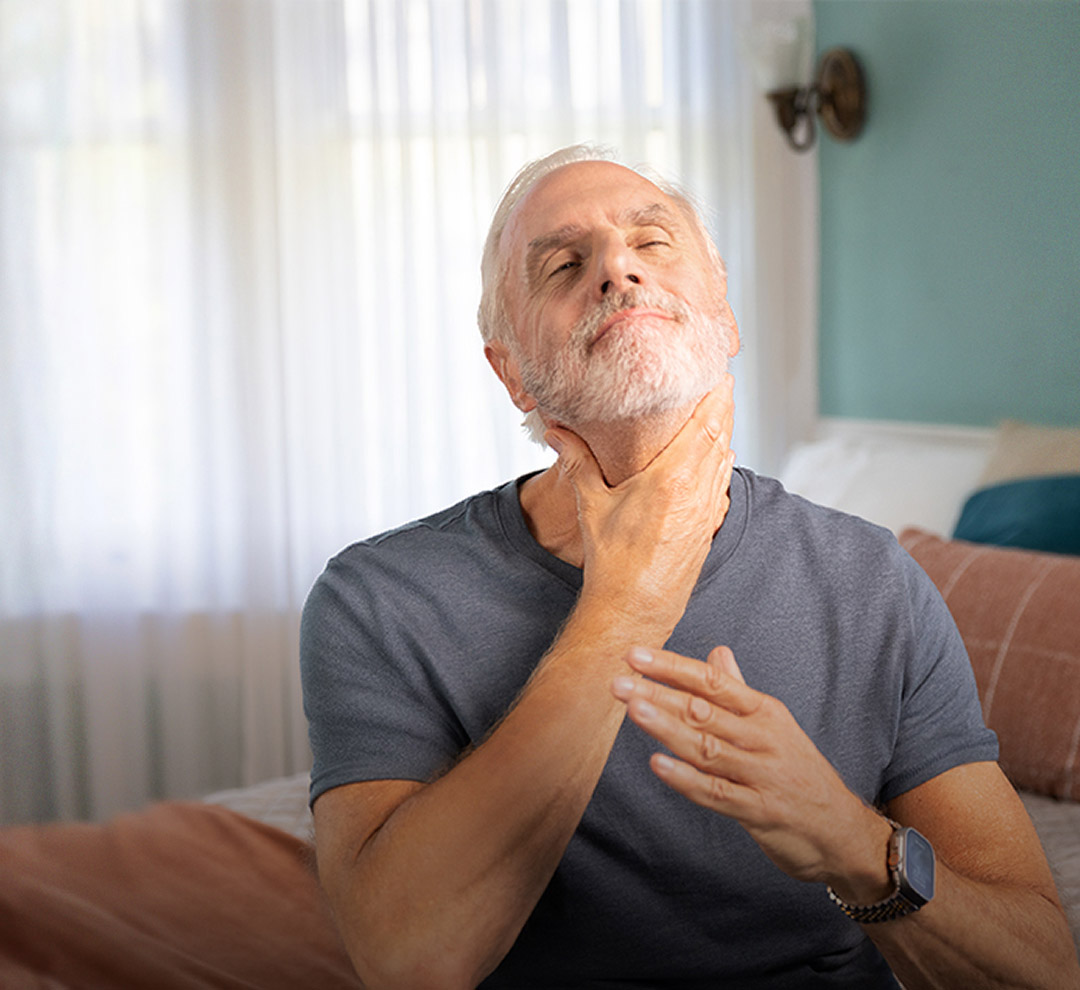 Man rubbing his neck