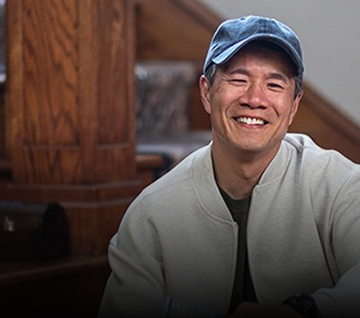 Man in a hat smiling