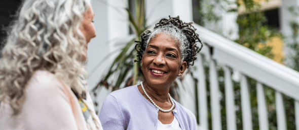 Two elderly women talking